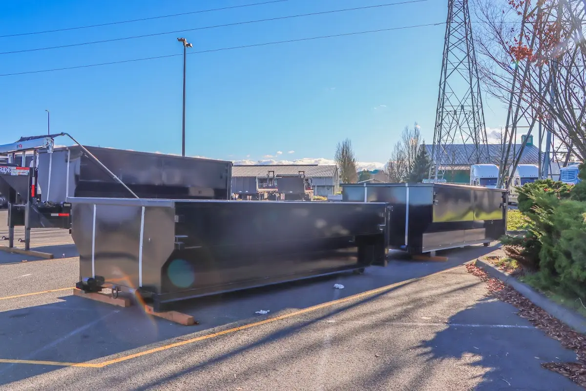 Roll-off dumpster ready for waste disposal at job site for Demolition Dumpster Rental in Breitung